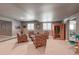 This is a finished basement with armchairs, a table, and an infrared sauna at 21916 E Swallow Pl, Aurora, CO 80016