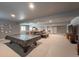 This is a finished basement with a covered pool table at 21916 E Swallow Pl, Aurora, CO 80016
