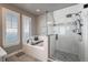 Bright bathroom featuring soaking tub, walk-in shower with glass door, and tiled floor at 21916 E Swallow Pl, Aurora, CO 80016