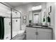 Stylish bathroom with a modern shower, vanity, and well-lit mirror at 21916 E Swallow Pl, Aurora, CO 80016