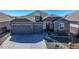 Charming single-Gathering home featuring a three-car garage and stone accents at 21916 E Swallow Pl, Aurora, CO 80016