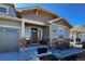 Inviting front porch with stone accents and seating, perfect for relaxing outdoors at 21916 E Swallow Pl, Aurora, CO 80016