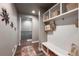 Well-lit hallway features built-in storage, seating, and decor at 21916 E Swallow Pl, Aurora, CO 80016