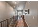 Bright and spacious hallway featuring hardwood floors and stylish decor at 21916 E Swallow Pl, Aurora, CO 80016
