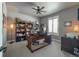 This home office features built-in bookshelves and a large wooden desk at 21916 E Swallow Pl, Aurora, CO 80016