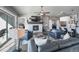 Spacious living room features a fireplace, with a TV above, and sliding barn doors to other rooms at 21916 E Swallow Pl, Aurora, CO 80016