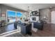 Open living room boasts fireplace, sliding glass doors to balcony, and views of the surrounding neighborhood at 21916 E Swallow Pl, Aurora, CO 80016