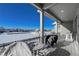 Covered porch includes seating, dining area and mountain views at 21916 E Swallow Pl, Aurora, CO 80016