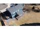 Aerial view of a spacious backyard featuring a covered patio and storage shed at 7404 La Quinta Ln, Lone Tree, CO 80124