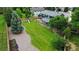 Expansive backyard featuring lush greenery, mature trees, a play structure, and a covered deck, perfect for outdoor enjoyment at 7404 La Quinta Ln, Lone Tree, CO 80124