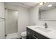Modern bathroom featuring a glass door shower, sleek vanity, and contemporary fixtures at 7404 La Quinta Ln, Lone Tree, CO 80124