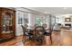 Charming dining area features hardwood floors, decorative cabinet and view to living area at 7404 La Quinta Ln, Lone Tree, CO 80124