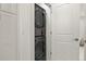Modern laundry area featuring a stacked washer and dryer at 7404 La Quinta Ln, Lone Tree, CO 80124
