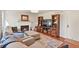 Cozy living room features a fireplace, hardwood floors, and comfortable seating at 7404 La Quinta Ln, Lone Tree, CO 80124