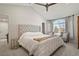 Spacious main bedroom featuring vaulted ceilings, cozy sitting area, and abundant natural light at 7404 La Quinta Ln, Lone Tree, CO 80124