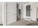 Mud room with carpet, stainless steel refrigerator, and multiple entry/exit doors at 7404 La Quinta Ln, Lone Tree, CO 80124