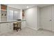 Basement office space features built-in cabinets, desk space and natural light from the window at 7404 La Quinta Ln, Lone Tree, CO 80124