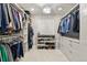 Custom walk-in closet with built-in shelves, drawers, and ample storage space at 7404 La Quinta Ln, Lone Tree, CO 80124