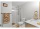 A beautifully remodeled bathroom showcasing modern fixtures, glass shower door, and neutral tiling at 660 S Alton Way # 10D, Denver, CO 80247