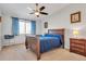 Spacious bedroom with ceiling fan and ample closet space at 660 S Alton Way # 10D, Denver, CO 80247