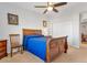 Charming bedroom with a wooden bed frame and plenty of natural light at 660 S Alton Way # 10D, Denver, CO 80247