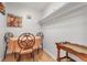 Small dining room featuring an round table with wood chairs and a side table, illuminated by neutral paint at 660 S Alton Way # 10D, Denver, CO 80247