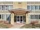 Building entrance with a covered entryway and access to the building at 660 S Alton Way # 10D, Denver, CO 80247
