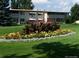 Apartment building with well-manicured lawns and mature landscaping at 660 S Alton Way # 10D, Denver, CO 80247