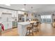 Modern kitchen with white cabinets, stainless steel appliances, and an island at 660 S Alton Way # 10D, Denver, CO 80247