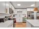 Modern kitchen with white cabinets, stainless steel appliances, and an island at 660 S Alton Way # 10D, Denver, CO 80247