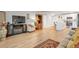 Bright living room featuring hardwood floors and an open concept layout at 660 S Alton Way # 10D, Denver, CO 80247