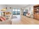 Spacious living room with light flooring and access to a balcony at 660 S Alton Way # 10D, Denver, CO 80247