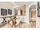 Open-concept space with dining area, kitchen bar, and hallway views at 9019 E Panorama Cir # D504, Englewood, CO 80112