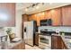 Well-equipped kitchen with stainless steel appliances and granite countertops at 9019 E Panorama Cir # D504, Englewood, CO 80112