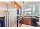 Spacious kitchen featuring stainless steel appliances, and view to the living room at 9019 E Panorama Cir # D504, Englewood, CO 80112