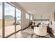 Inviting living room with hardwood floors and sliding glass doors to a private terrace at 9019 E Panorama Cir # D504, Englewood, CO 80112