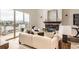 Cozy living room with fireplace, balcony access, and comfortable seating at 9019 E Panorama Cir # D504, Englewood, CO 80112