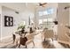 Bright living space with high ceilings, fireplace, and stylish dining area at 9019 E Panorama Cir # D504, Englewood, CO 80112