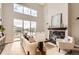 Living room with large windows, fireplace, and modern decor at 9019 E Panorama Cir # D504, Englewood, CO 80112