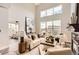 Bright living room with tall ceilings, modern furniture, and stylish decor at 9019 E Panorama Cir # D504, Englewood, CO 80112