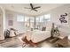 Bright main bedroom with large windows, ceiling fan, and stylish decor at 9019 E Panorama Cir # D504, Englewood, CO 80112
