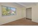 This bedroom features a window with a view, a closet with sliding mirrored doors, and neutral walls at 3580 Broadway St # 3, Boulder, CO 80304