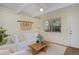 Cozy living room featuring a comfortable sofa, ceiling fan and natural light from the large window at 3580 Broadway St # 3, Boulder, CO 80304