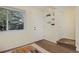 Bright living room with door, built-in shelving, and natural light from the large window at 3580 Broadway St # 3, Boulder, CO 80304