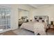 This main bedroom features a mirror closet door and access to a private balcony at 3580 Broadway St # 3, Boulder, CO 80304