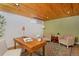 Office with wood ceiling, desk, neutral chairs, and colorful rug at 3580 Broadway St # 3, Boulder, CO 80304
