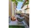Secluded backyard patio with a wooden bench, rocking chair and privacy fence creating a private outdoor oasis at 3412 Valentia St, Denver, CO 80238
