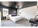 Spacious bedroom with a white bed and modern décor at 3412 Valentia St, Denver, CO 80238
