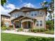 Charming two-story home featuring a well-maintained lawn and beautifully landscaped front yard at 3412 Valentia St, Denver, CO 80238
