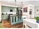 Bright and spacious kitchen with an island and dining area at 3412 Valentia St, Denver, CO 80238